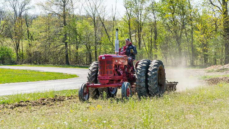 Farmer with Tractor by Denny Beck sm